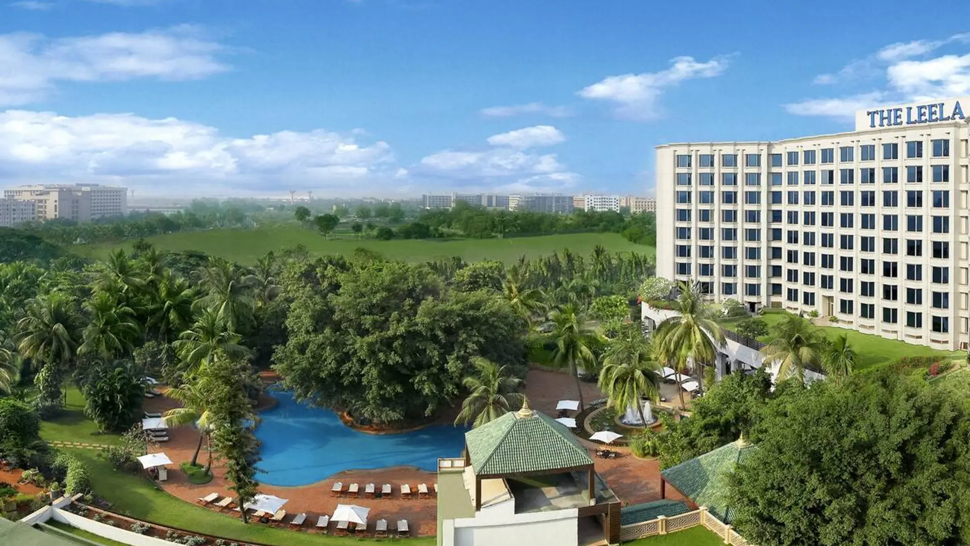 Bird perspective of The Leela, Mumbai at daytime with view of the hotel and pool area