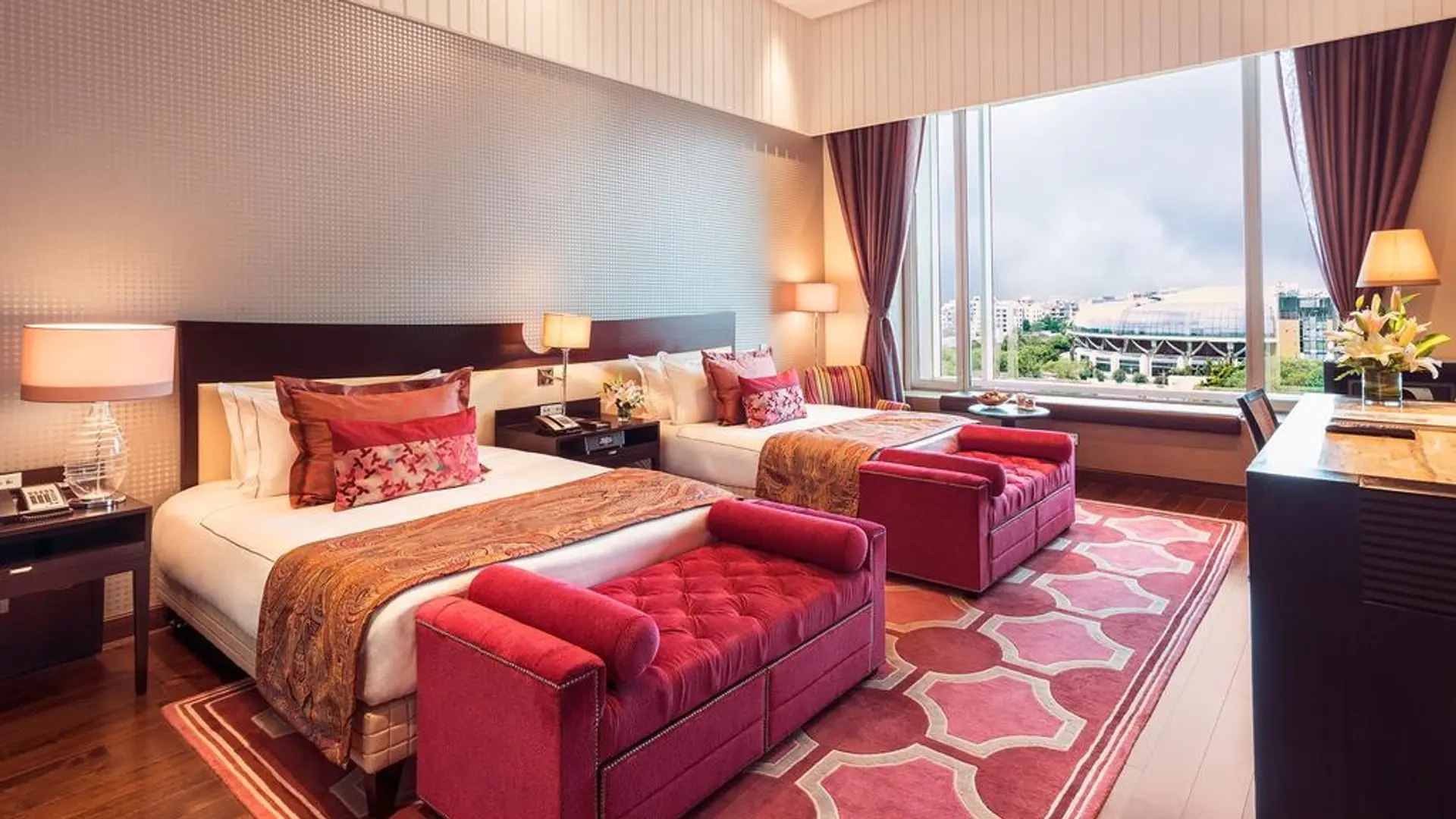 Hotel room at Taj Santacruz, Mumbai with double bed and large windows 