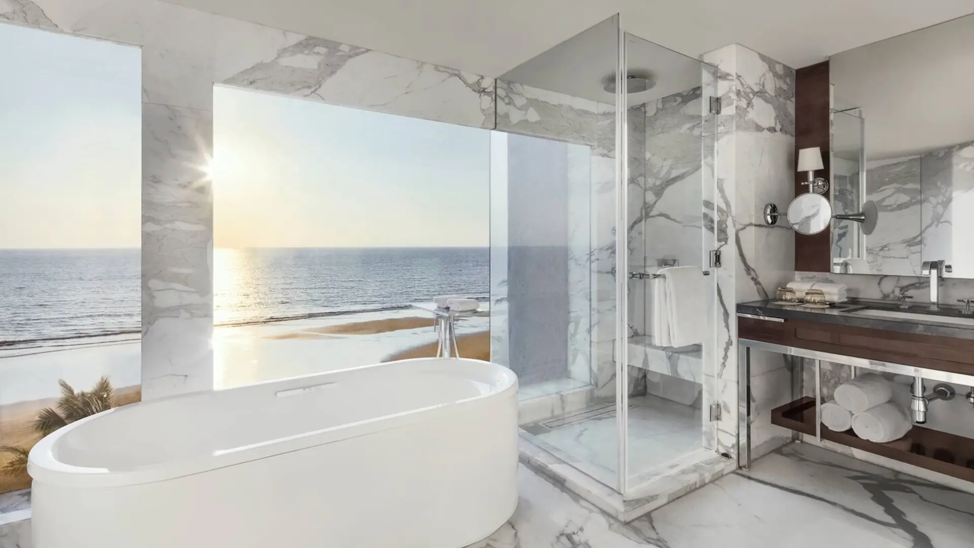 Bathroom with view of the ocean through large windows at the JW Marriot Mumbai Juhu