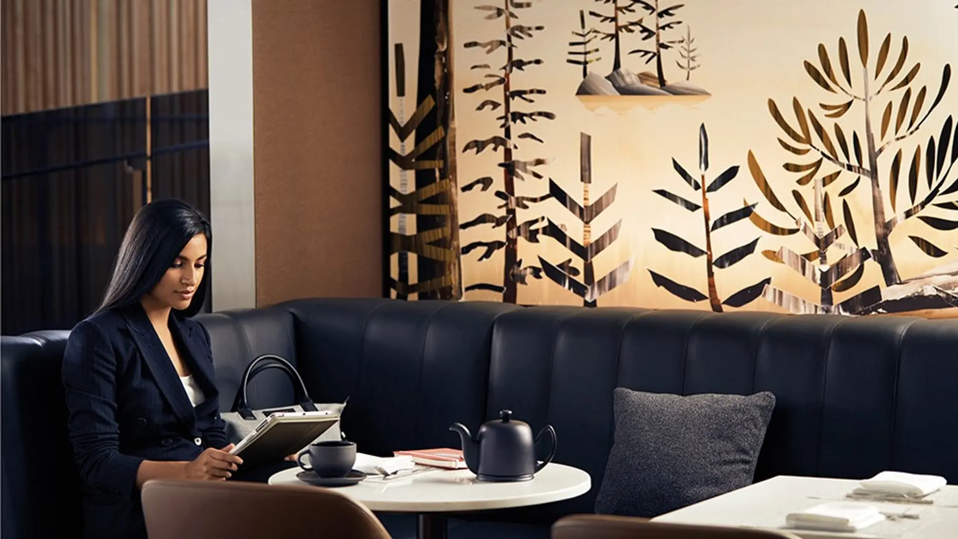 woman on her laptop at Air Canada - Signature Suite, Toronto Pearson International Airport, Toronto